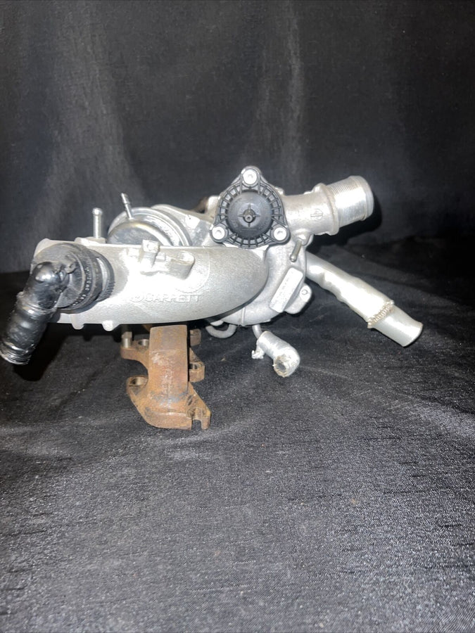 Chevrolet Sonic OEM Garrett Turbocharger w/ Manifold 55565353 Trax Cruz (11-19)