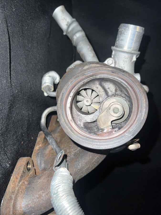 Chevrolet Sonic OEM Garrett Turbocharger w/ Manifold 55565353 Trax Cruz (11-19)